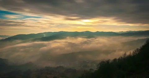 Sunrays and clouds rolling at sunrise timelapse Stock Footage 89478164