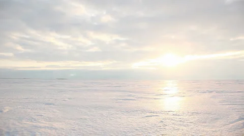 Sunrays and glowing reflection on snowfield form the sunshine, timelapse 動画素材 1808469