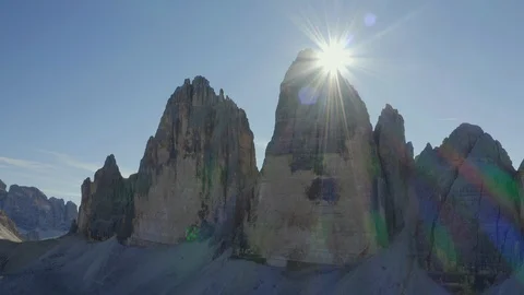 Sunrays behind the Three Peaks  of Lavaredo Mountains Stock Footage 128947451