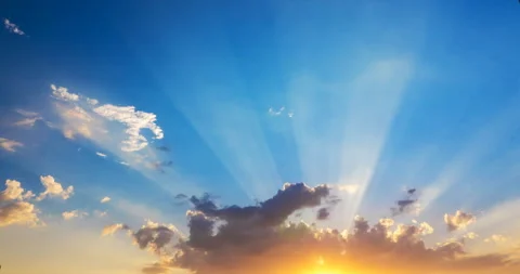 Sunrays flying clouds at sunset Stock Footage 138441379