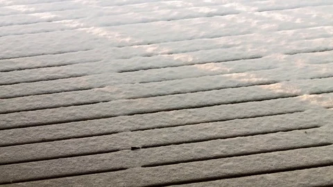 Sunrays moving over snowy patio boards time-lapse Stock-Footage 71263759