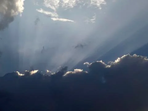 Sunrays over sunset sky Stock Photos