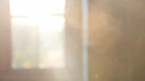 Sunrays shines through a window into a smoky, haunted house Stock Footage 100670432