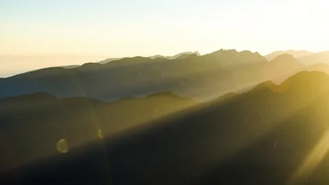 Sunrays Shining over Mountains and Fog at Sunset Stock Footage 73219127