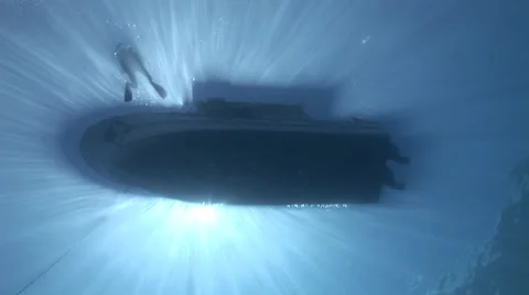 Sunrays Silhouetting a Boat Stock Footage 53303425