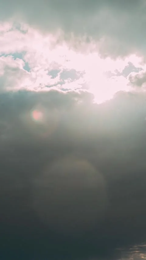 Sunrays Sunray Shine Through Dark Clouds In Cloudy Blue Sky. Natural Background Stock Footage 341174295