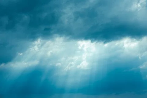 Sunrays Through Blue Rainy Dramatic Sky. Natural Abstract Background Photos