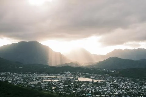 Sunrays through clouds on mountains Stock Photos