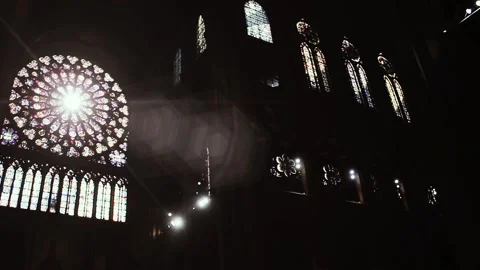 Sunrays through the Rose Window in the famous Notre Dame Cathedral, Paris. Video stock 117751954