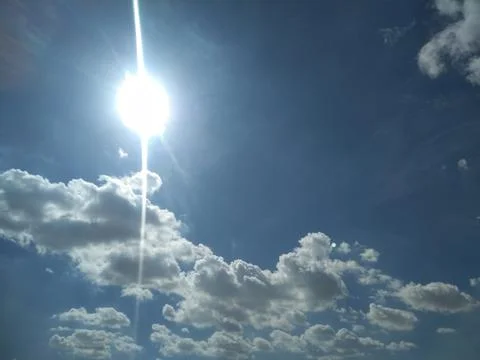 The sunrays view in the blue sky with clouds Stock Photos