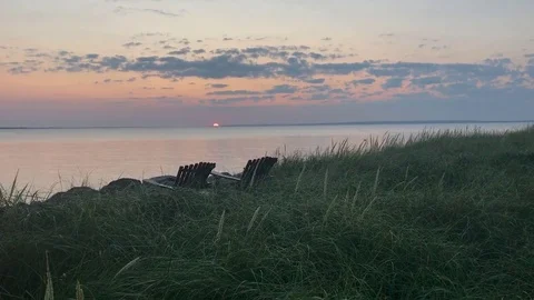 Sunrise with 2 chairs in grass Vídeo Stock 84939990