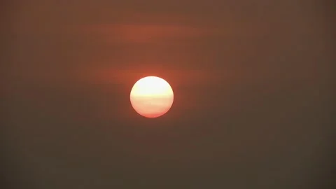 Sunrise 4k. Clouds and Sun Rising Sky  Closeup Telephoto Lens Stock Footage 205250846