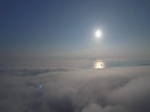 Sunrise above the clouds and sea. Aerial video with drone. Stock Footage