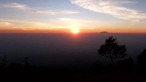 Sunrise above the clouds at the top of mount merbabu Stock Footage 143238833