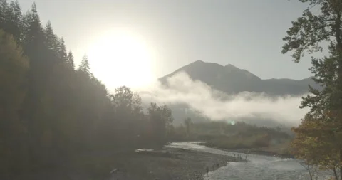 SUNRISE above MOUNTAINS and RIVER Stock Footage 164809062