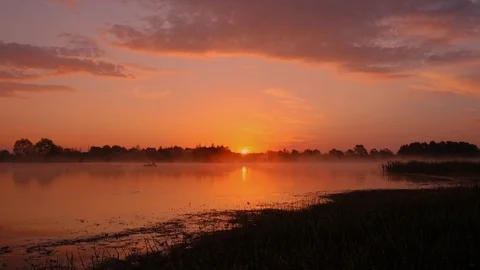 Sunrise above the pond with cloudy sky at summer. Stock Footage 108858583