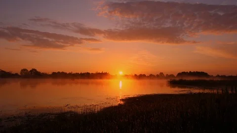 Sunrise above the pond with cloudy sky at summer. Stock Footage 108858611