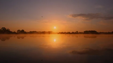 Sunrise above the pond with cloudy sky at summer. Stock Footage 108858633