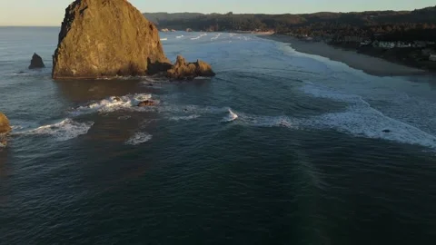 Sunrise Aerial Fly-By of Haystack Rock in Cannon Beach, Oregon Stock Footage 300510086