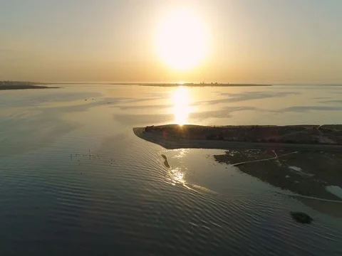 Sunrise aerial seascape view of Olhao dockyard waterfront. (Shot M - Pan Left) Stock Footage