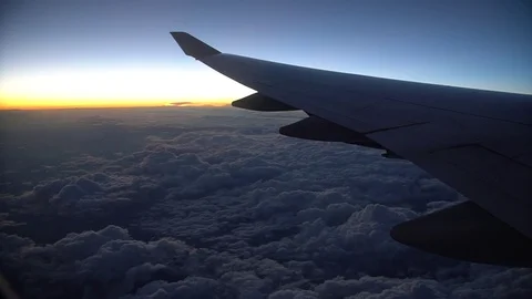 Sunrise Airplane Wing Over Clouds Stock Footage 83550915