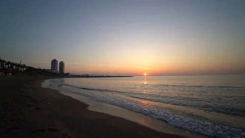Sunrise alone on the beach in Barcelona Stock Footage