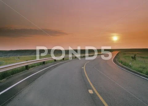 Sunrise along road at Horsethief Canyon near Drumheller, Alberta, Canada. Stock Photos