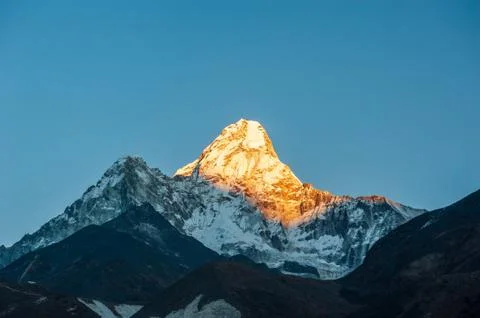 Sunrise on Ama Dablam peak mountain. Trekking in Nepal Himalayas. EBC (Everes Stock Photos