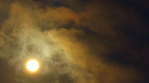 Sunrise amid dark sky with fast moving, foreboding clouds, time lapse 스톡 동영상 116506653