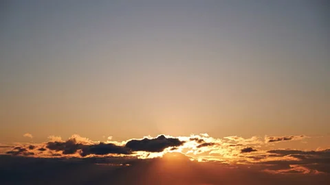 Sunrise among beautiful clouds. Orange sun in the morning sky, timelapse Stock Footage 197407195