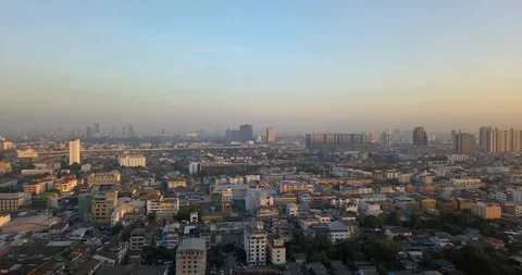 Sunrise and clear sky with backing up between two skyscrapers in Bangkok Stock Footage 108470040