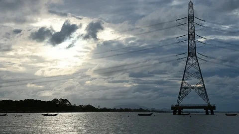 Sunrise and cloud timelapse with high voltage electricity poles in industrial Stock Footage 115116004