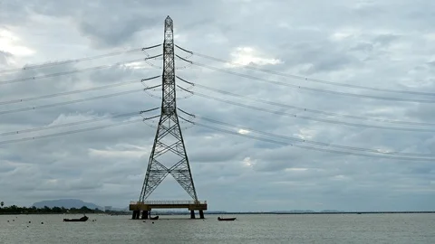 Sunrise and cloud timelapse with high voltage electricity poles in industrial Stock Footage 115261045