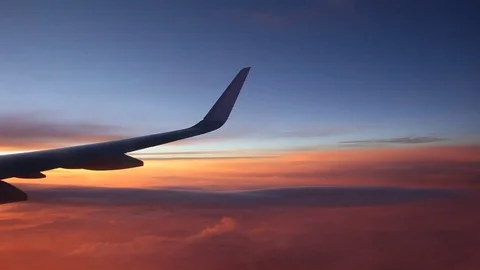 Sunrise and pink clouds, shot from a plane. Stock Footage 80563160
