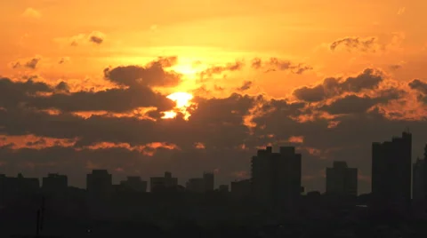 Sunrise Autumn 4K - Time lapse. Sun rising  behind the buildings. Skyline Stock Footage