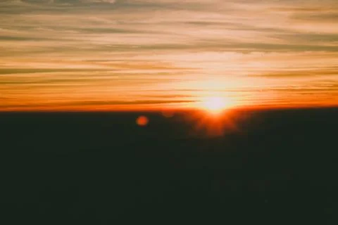 Sunrise backlit sky with cloud on the top of mountain Foto stock