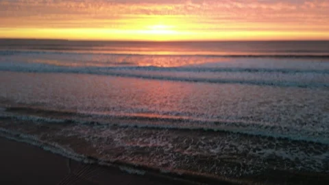 Sunrise At Barmston pull back reveal drone footage Stock Footage 247558613