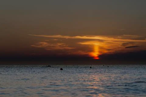 Sunrise beach in adriatic sea Stock Photos