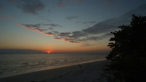SUNRISE ON BEACH, BEAUTIFUL STATIC SHOT Stock Footage 72563503