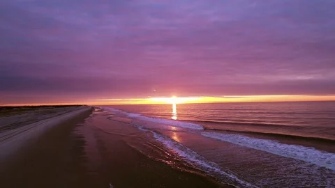Sunrise beach Epic clouds and waves Stock Footage 74088712