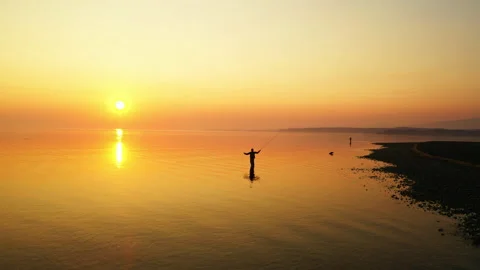 Sunrise beach fishing drone silhouette Stock Footage