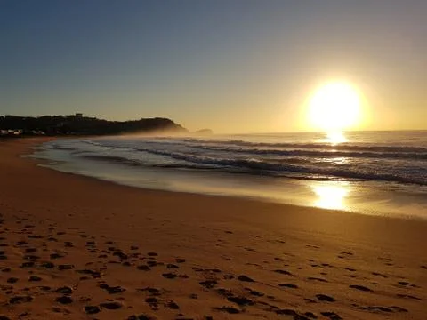 Sunrise at the beach Stock Photos
