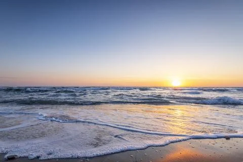 Sunrise at the beach. Stock Photos