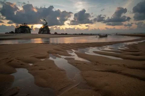 Sunrise at the beach with unique sand formation Stock Photos