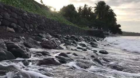 Sunrise at the beach with volcanic rocks 스톡 동영상 138651300