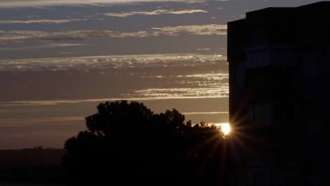 Sunrise Behind Building and Tree Stock Footage 238766655
