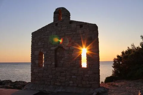 Sunrise behind a chapel Stock Photos