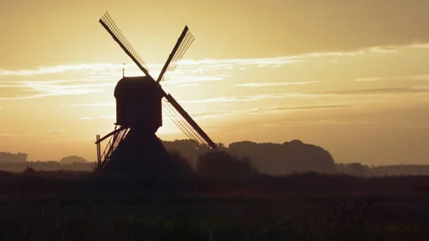 Sunrise behind a Dutch windmill 動画素材 144845275