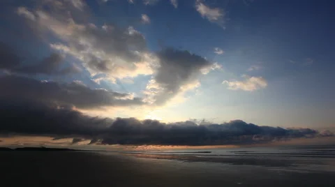 Sunrise behind low clouds at cherry grove beach, sc Stock Footage 49227458