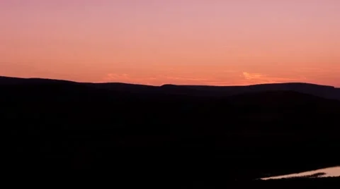Sunrise from behind the mountains, timelapse move Stock Footage 8519778